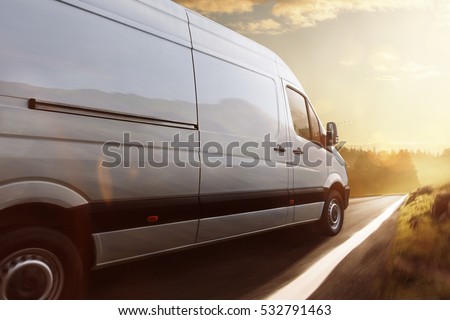 Delivery truck drives on a road