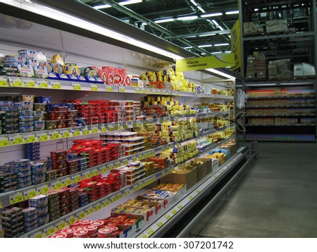 OMSK, RUSSIA - DECEMBER 06, 2009: Refrigerated display case with assortment spreads of butter in store