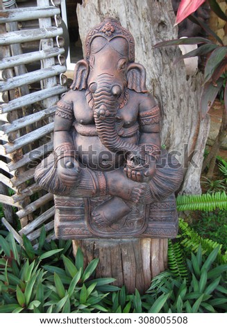 KOH SAMUI, THAILAND - OCTOBER 24, 2013: Sculpture of buddhistic deity with face of elephant (Ganesha)