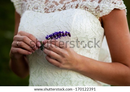 Bride\'s hands with mint flower