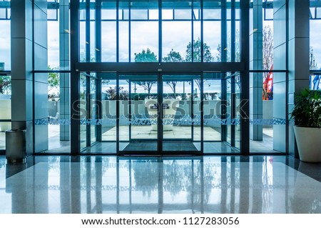 Glass automatic sliding doors entrance into shopping mall