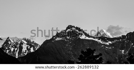 Majestic high peaks of Southern Alps in black and white at sunset, New Zealand.