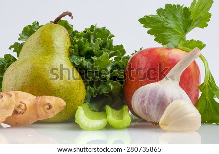 Ingredients for kale shake isolated on white background. Kale, celery, pink lady apple, pear, garlic, and ginger
