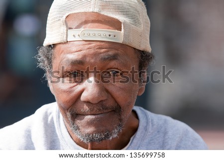Closeup of old homeless African American Man outdoors