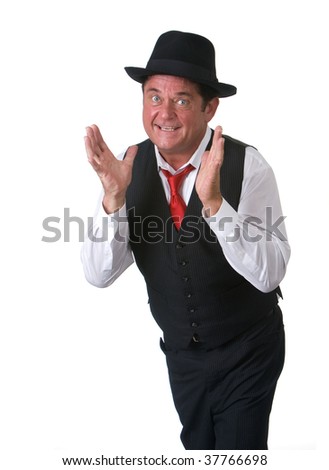 Man with a hat and blue eyes showing expression while explaining. Shot against a white background.