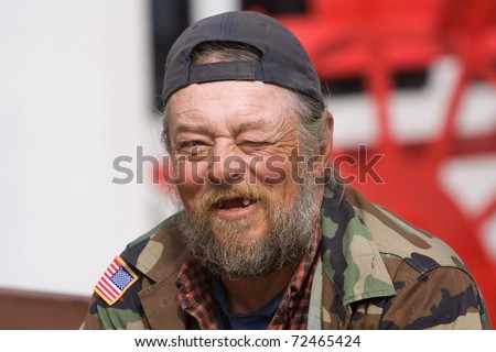 stock-photo-portrait-of-white-homeless-man-smiling-outside-72465424.jpg