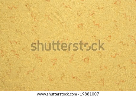 Wall-paper of beige colour from a paper with abstract relief drawing close up