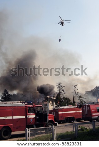 MOSCOW - AUGUST 30:  Firemen extinguish a fire in pavilion 