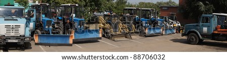 MOSCOW - AUGUST 30: Panorama of rank tractors and minibulldozers on \