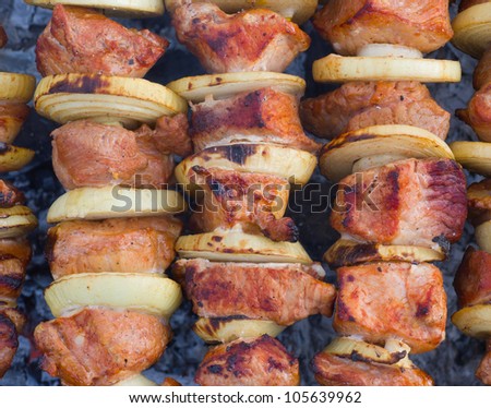 Shashlik - Georgian meal with meat and vegetables cooked on smouldering carbons