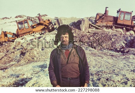 Portrait of young soviet gold-prospector - Vintage photo taken on a gold-field in tundra, Chukchi Peninsula, USSR, July 1984