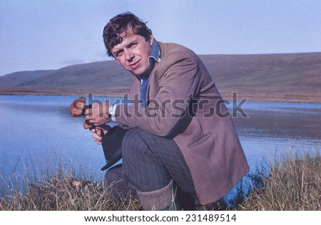 Portrait of soviet gold-prospector mushrooming in tundra - vintage photo taken on Chukchi Peninsula in July 1983.