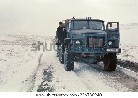 Chukchi Peninsula, USSR - September 1979: Expeditionary tank truck Ural-4320 having short stop on the road to remote station