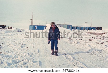 Chukchi Peninsula, USSR - 17 April, 1980: Soviet gold prospector on the only street of small gold-prospectors\' settlement in tundra.