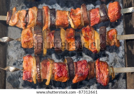 Shashlik - Georgian national meal with meat and vegetables cooked on smouldering carbons.