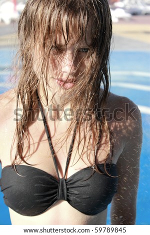 girl in splashes from a fountain