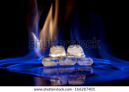 fire and ice cube on black background