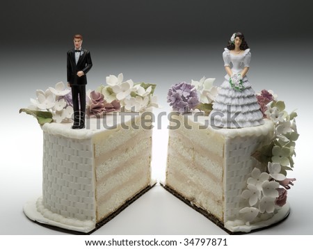  and groom figurines standing on two separated slices of wedding cake