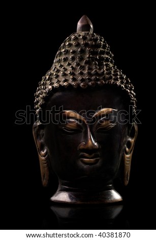A metal statue of Buddha, intricate detail.