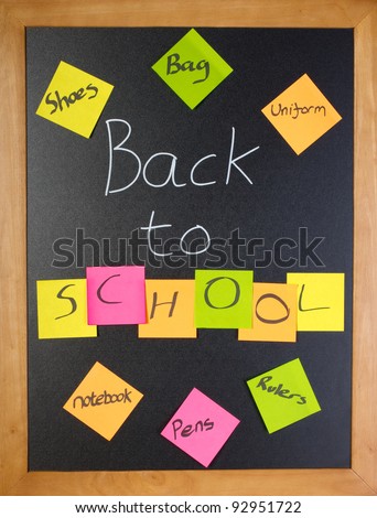 Chalk blackboard with a fun back to school message and shopping list
