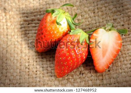 Close up of fresh strawberry on texture background. selective focus.