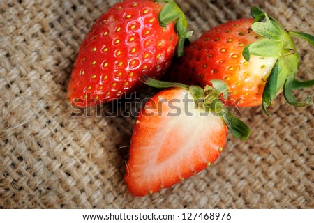 Close up of fresh strawberry on texture background. selective focus.
