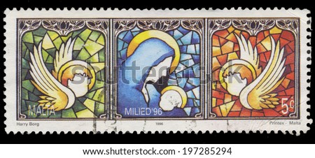 MALTA - CIRCA 1996: A stamp printed in Malta shows drawing of a window with the virgin and the child and the angels, circa 1996