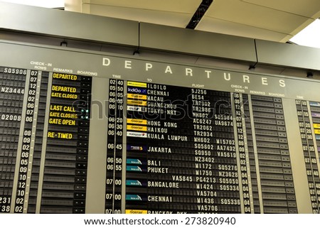 SINGAPORE - JANUARY 16: Departure information monitors at Changi Airport, Singapore on January 16, 2015. Singapore airport is the main aviation hub in South East Asia.