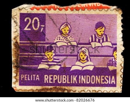 INDONESIA-CIRCA 1960: A stamp printed in Indonesia shows students in the classroom,  circa 1960.
