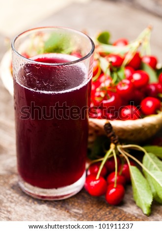 Glass of stewed sweet cherry fruit