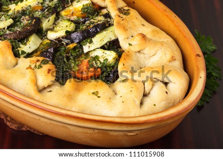 Cake with vegetables, baked in the pottery