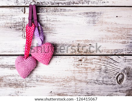 Crochet valentine hearts handing on the rope Valentine's day greeting card Love concept Crochet valentine hearts handing on the rope Valentine's day greeting card Love concept
