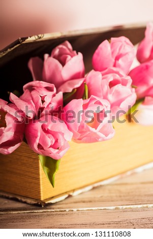 Shabby chic decoration - pink tulips in vintage book