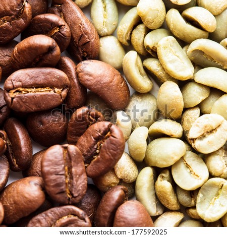 Black and green coffee beans as a background. Various types of coffee