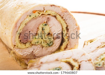chicken roll with omelette on the wooden board