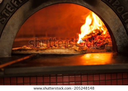 Pizza baking close up in the oven