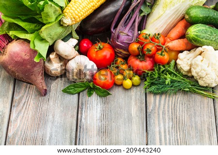 Various vegetables on a wooden table with copy space