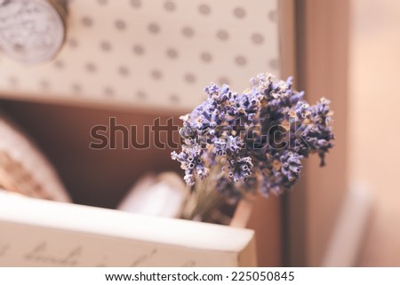 Bunch of dry lavender in decorative little shabby chic chest of drawers