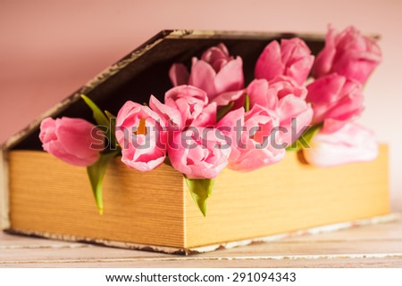 Shabby chic decoration - pink tulips in vintage book