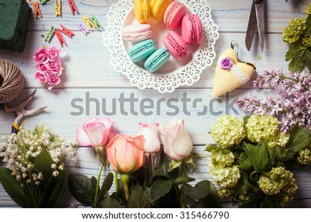 Sweet macarons and flowers - preparation of present