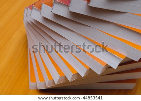 Stack of book in office desktop. Close up paper\'s pages.