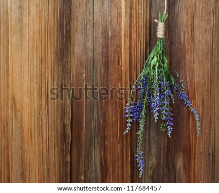 Bouquet of medicinal herbs on an old wooden background