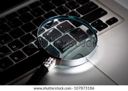 Magnifier on computer notebook , Concept of searching