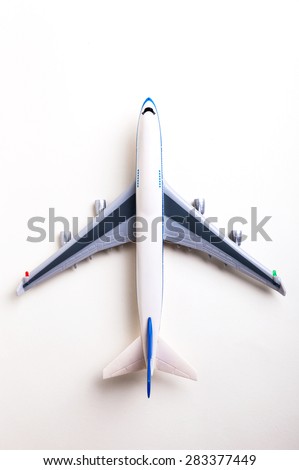 toy plane on white background, top view