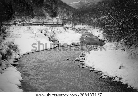 black and white image of river in snow winter time,Japan
