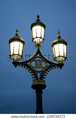 Lamp post against blue sky