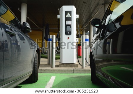 Electrical cars charging battery at station