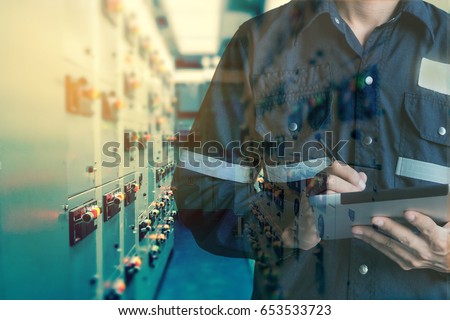 Double exposure of Engineer or Technician man working with tablet in switch gear electrical room oil and gas platform or plant industrial for monitor process, business and electrical industry concept.