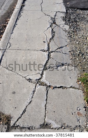 Cracked Sidewalk in Urban Area