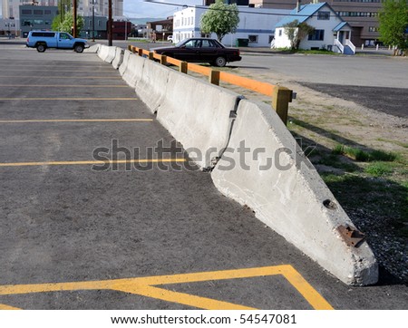 Concrete Barrier between parking lots